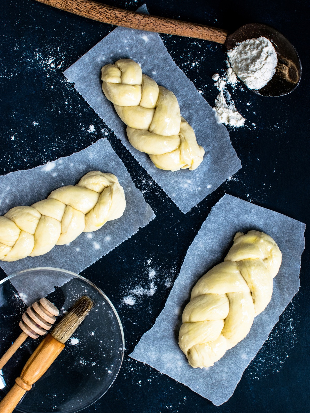 Smooth enriched dough shaped into braided loaves